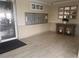 Inviting lobby area featuring mailboxes, modern decor, and sleek wood-look tile flooring at 7922 Sailboat Key S Blvd # 608, South Pasadena, FL 33707