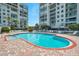Beautiful pool with a brick surround offers the perfect spot for relaxation and recreation at 7922 Sailboat Key S Blvd # 608, South Pasadena, FL 33707