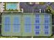 Aerial view of multiple tennis courts with professional surfaces, nets, and surrounding foliage at 7922 Sailboat Key S Blvd # 608, South Pasadena, FL 33707
