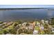 Scenic aerial view of waterfront homes with docks, providing direct access to the beautiful bay and the calm water at 824 35Th Avenue W Dr, Palmetto, FL 34221