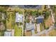 Stunning aerial view of multiple homes showcasing their roof lines, yards, and surrounding landscapes in a residential area at 824 35Th Avenue W Dr, Palmetto, FL 34221