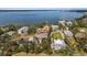 Aerial shot capturing bayfront homes with lovely views of docks, lush greenery, and peaceful waters at 824 35Th Avenue W Dr, Palmetto, FL 34221