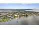 Expansive aerial view of waterfront community with private docks, lush landscaping, and stunning coastal scenery at 824 35Th Avenue W Dr, Palmetto, FL 34221