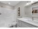 This bathroom features a shower/tub, vanity, mirror, and artwork at 824 35Th Avenue W Dr, Palmetto, FL 34221