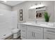 This bathroom features a shower/tub, vanity, mirror, and decorative artwork at 824 35Th Avenue W Dr, Palmetto, FL 34221