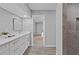Modern bathroom features a white vanity with bright lighting and a tiled walk-in shower at 824 35Th Avenue W Dr, Palmetto, FL 34221