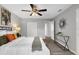This bedroom features a ceiling fan, closet, and a decorative piece on the wall at 824 35Th Avenue W Dr, Palmetto, FL 34221