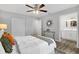 This bedroom features a ceiling fan, closet, and doorway to the bathroom at 824 35Th Avenue W Dr, Palmetto, FL 34221