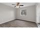 Light and airy bedroom with stylish gray walls, a modern ceiling fan, and wood-look floors at 824 35Th Avenue W Dr, Palmetto, FL 34221