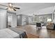 Large bedroom with hardwood floors features a queen bed, ceiling fan, and ample lighting at 824 35Th Avenue W Dr, Palmetto, FL 34221