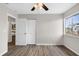Spacious bedroom with a ceiling fan, closet with bi-fold doors, and a view to another room at 824 35Th Avenue W Dr, Palmetto, FL 34221
