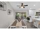 Open dining area with views of a covered porch and outdoor seating from sliding glass doors at 824 35Th Avenue W Dr, Palmetto, FL 34221