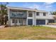 Charming two-story home featuring a balcony and a well-maintained lawn, enhancing its curb appeal at 824 35Th Avenue W Dr, Palmetto, FL 34221