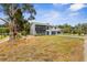 Two-story home with a balcony and a well-maintained lawn, creating an inviting curb appeal at 824 35Th Avenue W Dr, Palmetto, FL 34221
