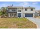 Charming two-story home featuring a balcony and a well-maintained lawn, enhancing its curb appeal at 824 35Th Avenue W Dr, Palmetto, FL 34221
