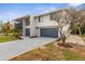 Two-story home featuring a balcony and a well-maintained lawn, enhancing its curb appeal at 824 35Th Avenue W Dr, Palmetto, FL 34221