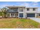 Charming two-story home boasting a well-manicured lawn, upper porch, and an attached two car garage at 824 35Th Avenue W Dr, Palmetto, FL 34221