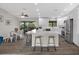Bright kitchen features stainless steel appliances, white cabinetry and large center island with bar stool seating at 824 35Th Avenue W Dr, Palmetto, FL 34221