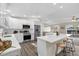 Modern kitchen features white cabinetry, stainless steel appliances, pendant lights, and a center island with stool seating at 824 35Th Avenue W Dr, Palmetto, FL 34221