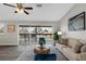 Comfortable living room with a view of the outdoor deck and lush greenery at 824 35Th Avenue W Dr, Palmetto, FL 34221