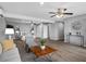 Open floor plan featuring a living room and bedroom combination, accentuated by vinyl floors and ample lighting at 824 35Th Avenue W Dr, Palmetto, FL 34221