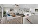 Open concept living area includes a kitchen, dining, and living space with high ceilings at 824 35Th Avenue W Dr, Palmetto, FL 34221