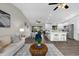 Open-concept layout connecting the living room, dining area, and modern kitchen for easy flow at 824 35Th Avenue W Dr, Palmetto, FL 34221