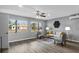 Bright and airy living room features modern decor, ceiling fan, and updated vinyl floors at 824 35Th Avenue W Dr, Palmetto, FL 34221
