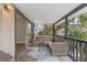 Covered porch features outdoor seating and screened in railing for unobstructed views of the yard at 824 35Th Avenue W Dr, Palmetto, FL 34221