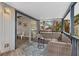 Covered porch with seating and views of the yard from large sliding glass doors at 824 35Th Avenue W Dr, Palmetto, FL 34221