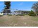 Image shows backyard space with pool and screened lanai at 8305 Palencia Dr, Port Richey, FL 34668