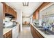 Functional kitchen featuring a large window with ample counter space and plenty of cabinet storage at 8305 Palencia Dr, Port Richey, FL 34668