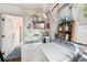 Laundry room with washer, dryer, and shelving at 8305 Palencia Dr, Port Richey, FL 34668