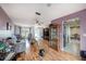 Spacious living room showcasing wood-look floors, and an open layout to the kitchen at 8305 Palencia Dr, Port Richey, FL 34668