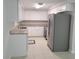 Well-lit kitchen with stainless steel appliances, ample cabinet space, and sleek countertops at 906 Balmoral Pl, Valrico, FL 33594