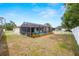 Fenced backyard featuring a screened pool area, providing a secure and enjoyable outdoor retreat at 9114 Dorsey St, Spring Hill, FL 34608