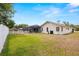 Expansive backyard with a screened-in pool and a white fence, creating a private and serene outdoor space at 9114 Dorsey St, Spring Hill, FL 34608
