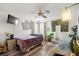 Comfortable bedroom with hardwood floors, ample natural light, and a calming color scheme at 9114 Dorsey St, Spring Hill, FL 34608