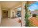 Charming front porch with lovely planters and stylish decor, leading to the front door at 9114 Dorsey St, Spring Hill, FL 34608