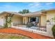 Inviting front porch with outdoor seating, creating a cozy and welcoming entrance at 9114 Dorsey St, Spring Hill, FL 34608