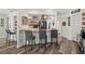 Open kitchen with breakfast bar seating, modern appliances, and easy access to dining area at 9114 Dorsey St, Spring Hill, FL 34608