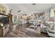 Spacious living room with hardwood floors, modern decor, and open-concept design at 9114 Dorsey St, Spring Hill, FL 34608