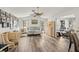 Bright living room featuring wood floors, neutral tones, modern décor, and natural light at 9114 Dorsey St, Spring Hill, FL 34608