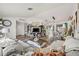 Open-concept living and dining area with modern decor and comfortable seating arrangement at 9114 Dorsey St, Spring Hill, FL 34608