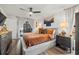 Bright main bedroom with hardwood floors, neutral décor, and access to a private outdoor space at 9114 Dorsey St, Spring Hill, FL 34608