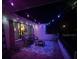 Cozy outdoor patio illuminated with colorful string lights, creating a magical ambiance for evening gatherings at 9114 Dorsey St, Spring Hill, FL 34608