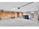 Spacious garage with overhead lighting and block wall construction at 9309 N Elmer St, Tampa, FL 33612