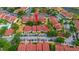 Aerial view of condo community showcasing ample parking, community pool, and lush landscaping at 9481 Highland Oak Dr # 710, Tampa, FL 33647