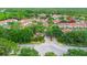 An aerial view showcases the unit's location within a tranquil community surrounded by lush greenery at 9481 Highland Oak Dr # 710, Tampa, FL 33647