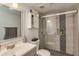 Updated bathroom featuring a glass-enclosed shower and modern vanity at 9481 Highland Oak Dr # 710, Tampa, FL 33647